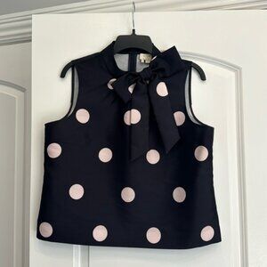 Stunning large polka dot top with a large bow detail